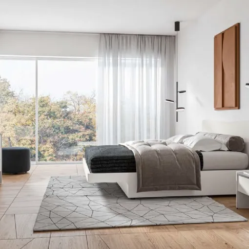Letto matrimoniale con testiera e giroletto sagomati e parte inferiore a sbalzo Leon GL12 di Marka Total Living